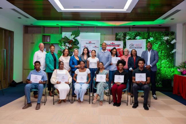 First-time recipients of the 2026 Carlton Alexander Memorial Bursary are pictured at the awards ceremony held last month at GraceKennedy’s headquarters in downtown Kingston. Sharing the moment are (standing, from left) Edward Alexander, son of the late C