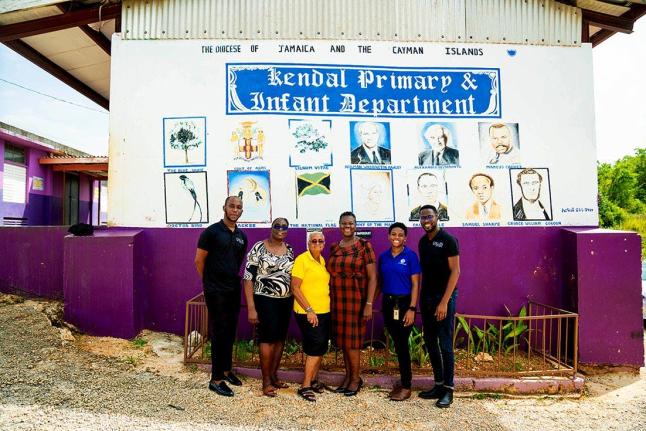Maxcine Headley (third right), principal of Kendal Primary and Infant, and secretary for JN Circle Mandeville takes a group photo (from left), De’Ante Livingston of the JN Group; Cheryl Walker, teacher at Kendal Primary and Infant; Mildred Rattary, treas