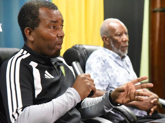 Rudolph Speid (left), the interim head coach for the  Reggae Boyz, announces the Nations League squad at the Jamaica Football Federation’s head office in New Kingston yesterday.  Looking on is Barry Watson  vice president of the JFF and chairman of the f