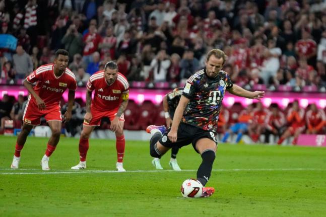  Bayern’s Harry Kane scores his side’s second goal  from the penalty spot during the Bundesliga match between Bayern Munich and Union Berlin in Munich, Germany yesterday.
