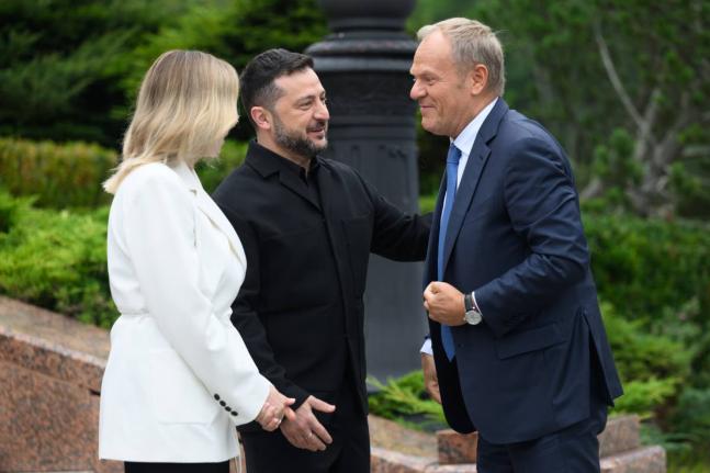 Poland’s Prime Minister Donald Tusk (right) is welcomed by Ukraine’s President Volodymyr Zelensky and his wife Olena Zelenska during a Carpathian 8 Summit in Bukovel, western Ukraine, Friday.