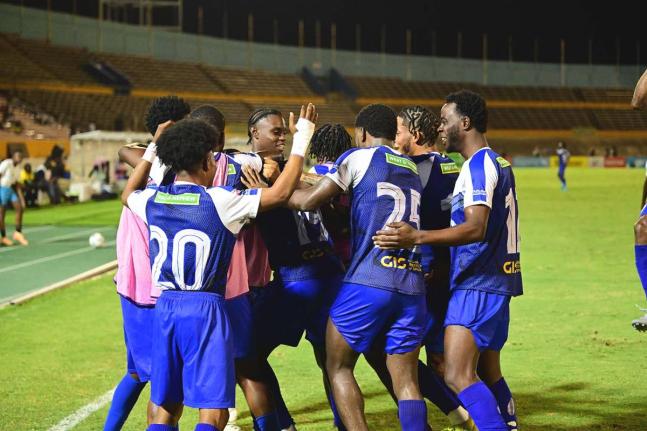 File 
Mount Pleasant Football Academy players celebrate winning a Jamaica Premier League football match at the National Stadium.