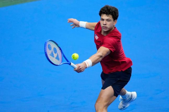 AP 
United States’ Ben Shelton returns the ball to Czechia’s Jakub Mensik during the Davis Cup second-round qualifier in Prague, yesterday.