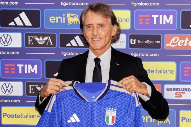 AP File 
Italy’s new national football team coach Roberto Mancini poses during a news conference, July 29, in Rome. 