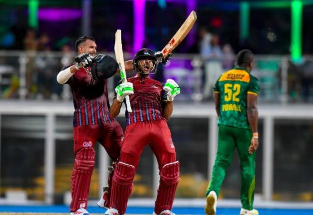 The Antigua and Barbuda Falcons batsmen celebrate their team's victory over the Jamaica Kingsmen at the end of the Caribbean Premier League final at Kensington Oval in Barbados on Sunday night. - CPL photo