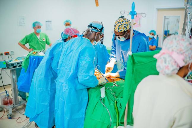 Doctors performing spine surgery at the University Hospital of the West Indies earlier this month. 