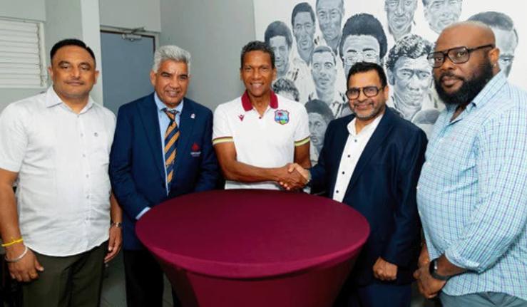 CEO of CWI, Chris Dehring (centre) and President of Cricket Canada, Arvinder Khosa (second right) shake hands during a recent meeting.