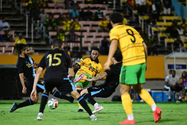 Reggae Boy Renaldo Cephas (centre) takes a shot at goal during last Friday’s Concacaf Nations League match against Guatemala at the National Stadium. Cephas scored the winner in Jamaica’s 3-2 victory.