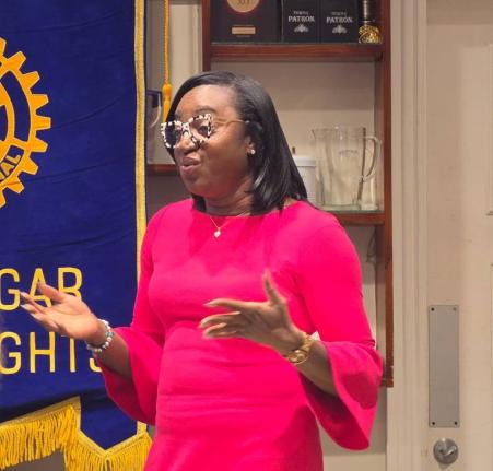 Saniah Spencer, chief product officer for savings and deposits at JN Bank, speaking at a recent meeting of the Rotary Club of Trafalgar New Heights, at Cru Bar and Kitchen on Lady Musgrave Road in St Andrew.