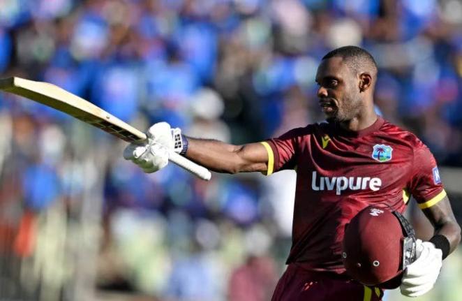 Justin Greaves celebrates scoring his maiden One-Day International century against India on Sunday.