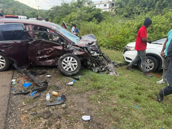 Onlookers gather at the scene of a motor vehicle crash involving a burgundy Honda CR-V, in which Jamaica Teachers' Association president-elect Dr Maureen Mullings-Nelson was a passenger, and a white Honda CR-V, near Duncans, Trelawny on October 1, 2026.